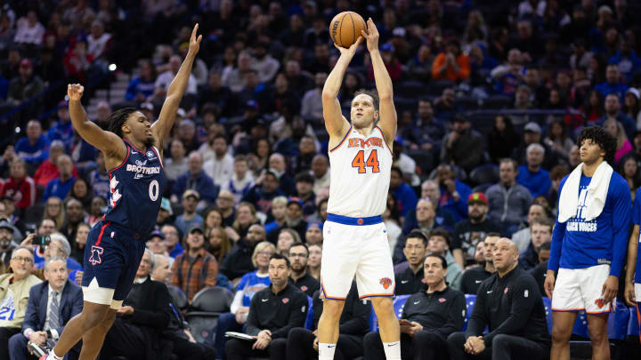 Feb 22, 2024; Philadelphia, Pennsylvania, USA; New York Knicks forward Bojan Bogdanovic (44) scores a three pointer in front of Philadelphia 76ers guard Tyrese Maxey (0) during the second quarter at Wells Fargo Center. Mandatory Credit: Bill Streicher-USA TODAY Sports