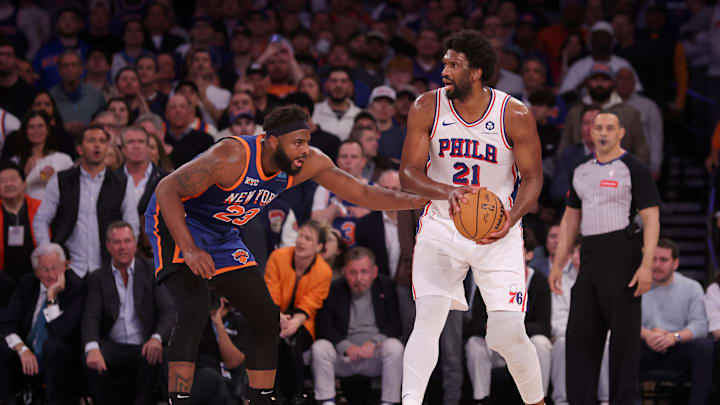 Apr 30, 2024; New York, New York, USA; Philadelphia 76ers center Joel Embiid (21) controls the ball against New York Knicks center Mitchell Robinson (23) during the fourth quarter of game 5 of the first round of the 2024 NBA playoffs at Madison Square Garden. Mandatory Credit: Brad Penner-Imagn Images