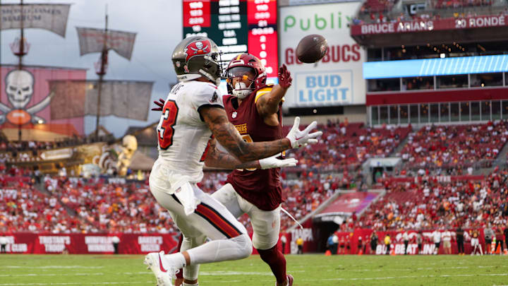 Sep 8, 2024; Tampa, Florida, USA; Tampa Bay Buccaneers wide receiver Mike Evans (13) catches a pass for a touchdown defended by Washington Commanders cornerback Benjamin St-Juste (25) in the fourth quarter at Raymond James Stadium. Mandatory Credit: Nathan Ray Seebeck-Imagn Images