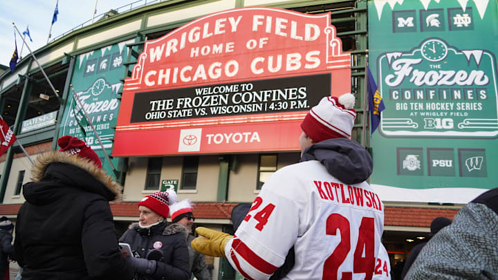 Hockey fans gather outside the stadium before the Frozen Confines college hockey games Saturday, January 4, 2024, at Wrigley Field in Chicago, Illinois. The women's game featured No. 1 Wisconsin vs. No. 2 Ohio State and the men's game pitted Wisconsin vs. No. 1 Michigan State to wrap up the two-day event.