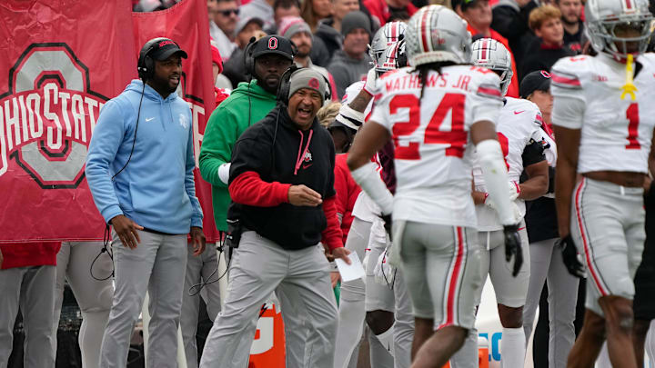 Ohio State Buckeyes secondary coach Tim Walton yells to cornerback Jermaine Mathews Jr. (24) during the NCAA football game against the Northwestern Wildcats at Wrigley Field in Chicago on Monday, Nov. 18, 2024. Ohio State won 31-7.