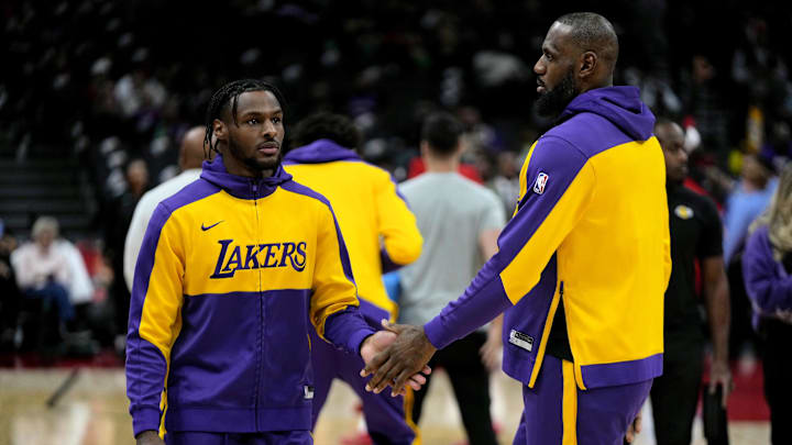 Los Angeles Lakers forward LeBron James and guard Bronny James before the start of the game against the Toronto Raptors at Scotiabank Arena.