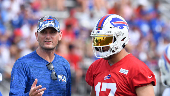 Jul 27, 2022; Pittsford, NY, USA; Buffalo Bills offensive coordinator Ken Dorsey talks with quarterback Josh Allen (17) 