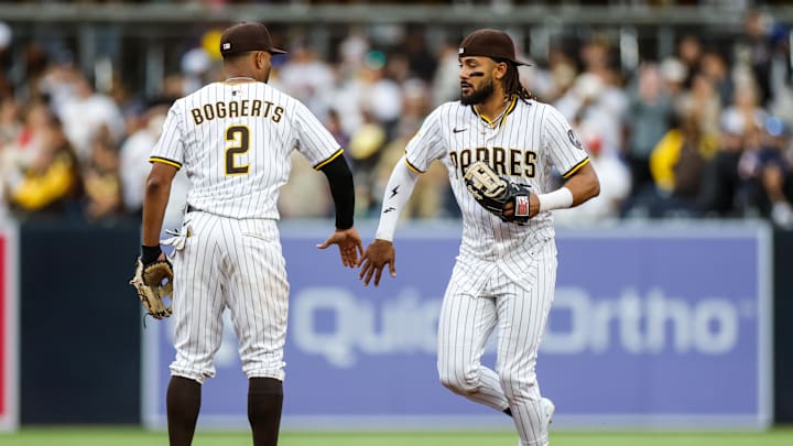 Mar 29, 2025; San Diego, California, USA; San Diego Padres right fielder Fernando Tatis Jr. (23) celebrates with San Diego Padres shortstop Xander Bogaerts (2) after a victory over the Atlanta Braves at Petco Park. Mandatory Credit: David Frerker-Imagn Images