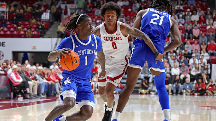 Jan 3, 2026; Tuscaloosa, Alabama, USA; Kentucky Wildcats guard Denzel Aberdeen (1) dribbles past Alabama Crimson Tide guard Labaron Philon (0) during the first half at Coleman Coliseum. Mandatory Credit: David Leong-Imagn Images