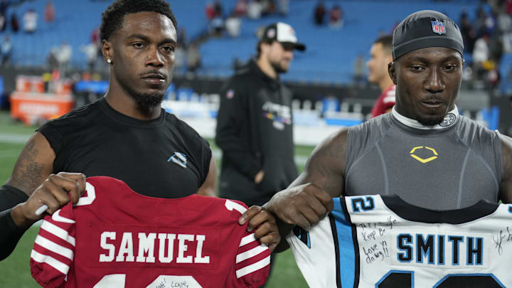 Oct 9, 2022; Charlotte, North Carolina, USA; Former South Carolina teammates San Francisco 49ers wide receiver Deebo Samuel (19) and Carolina Panthers wide receiver Shi Smith (12) swap jerseys at games end at Bank of America Stadium. Oct 9, 2022; Charlotte, North Carolina, USA; Former South Carolina teammates San Francisco 49ers wide receiver Deebo Samuel (19) and Carolina Panthers wide receiver Shi Smith (12) swap jerseys at games end at Bank of America Stadium.