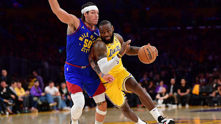 Apr 25, 2024; Los Angeles, California, USA; Los Angeles Lakers forward LeBron James (23) moves to the basket against Denver Nuggets forward Aaron Gordon (50) during the second half in game three of the first round for the 2024 NBA playoffs at Crypto.com Arena. Mandatory Credit: Gary A. Vasquez-Imagn Images