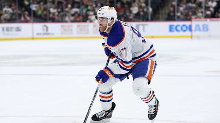 Dec 20, 2025; Saint Paul, Minnesota, USA; Edmonton Oilers center Connor McDavid (97) skates with the puck against the Minnesota Wild during the third period at Grand Casino Arena. Mandatory Credit: Matt Krohn-Imagn Images