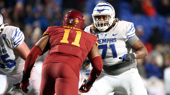 Dec 29, 2023; Memphis, TN, USA; Memphis Tigers offensive linemen Xavier Hill (71) blocks during the second half against the Iowa State Cyclones at Simmons Bank Liberty Stadium. Mandatory Credit: Petre Thomas-Imagn Images