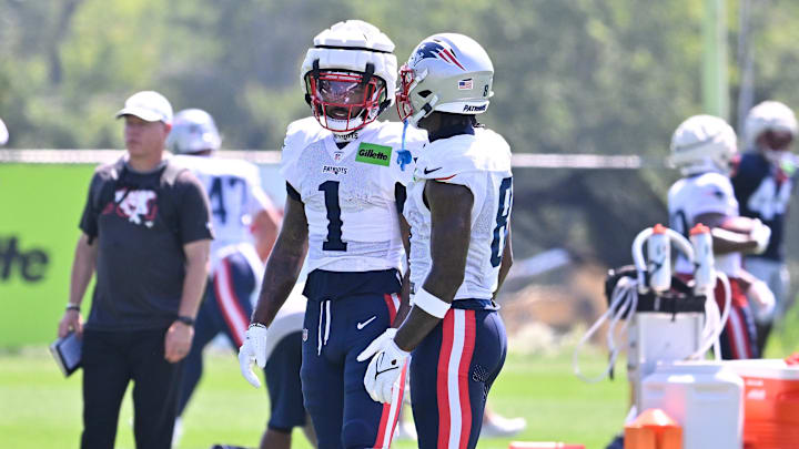 Jul 28, 2025; Foxborough, MA, USA; New England Patriots wide receiver Ja'Lynn Polk (1) and wide receiver Stefon Diggs (8) talk at training camp at Gillette Stadium. Mandatory Credit: Eric Canha-Imagn Images