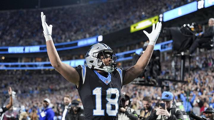 Jan 10, 2026; Charlotte, NC, USA;  Carolina Panthers wide receiver Jalen Coker (18) celebrates his score with fans during the second half of the NFC Wild Card Round game between the Carolina Panthers and the Los Angeles Rams at Bank of America Stadium. Mandatory Credit: Jim Dedmon-Imagn Images