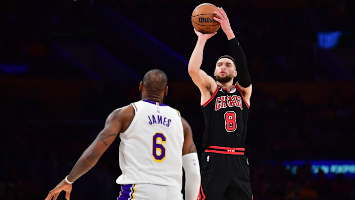 Mar 26, 2023; Los Angeles, California, USA; Chicago Bulls guard Zach LaVine (8) shoots against Los Angeles Lakers forward LeBron James (6) during the second half at Crypto.com Arena. Mandatory Credit: Gary A. Vasquez-Imagn Images