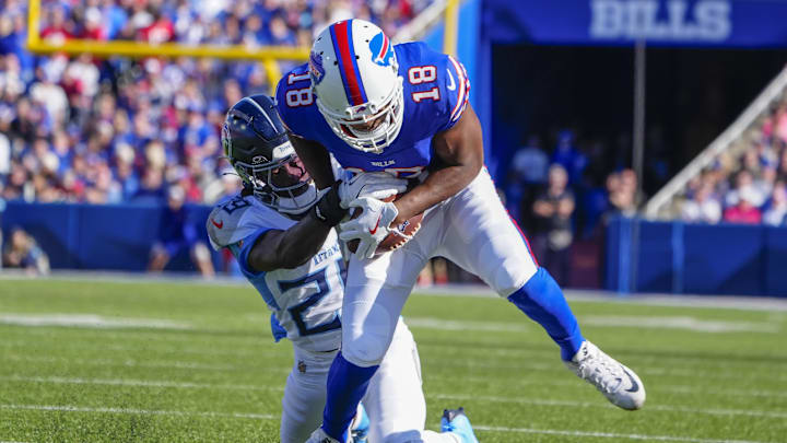 Oct 20, 2024; Orchard Park, New York, USA; Tennessee Titans cornerback Jarvis Brownlee Jr. (29) tackles Buffalo Bills wide receiver Amari Cooper (18) 
