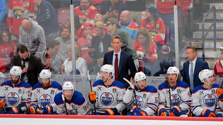 Jun 17, 2025; Sunrise, Florida, USA; Edmonton Oilers head coach Kris Knoblauch looks on from the bench during the third period in game six of the 2025 Stanley Cup Final at Amerant Bank Arena. Mandatory Credit: Sam Navarro-Imagn Images Jun 17, 2025; Sunrise, Florida, USA; Edmonton Oilers head coach Kris Knoblauch looks on from the bench during the third period in game six of the 2025 Stanley Cup Final at Amerant Bank Arena. Mandatory Credit: Sam Navarro-Imagn Images