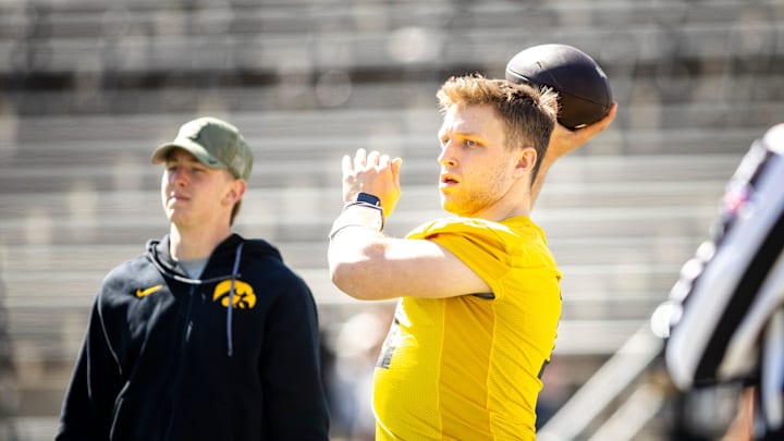 Apr 26, 2025; Iowa City, IA, USA; Iowa quarterback Mark Gronowski (11) throws during a spring NCAA football open practice at Kinnick Stadium. Mandatory Credit: Joseph Cress-The Des Moines Register