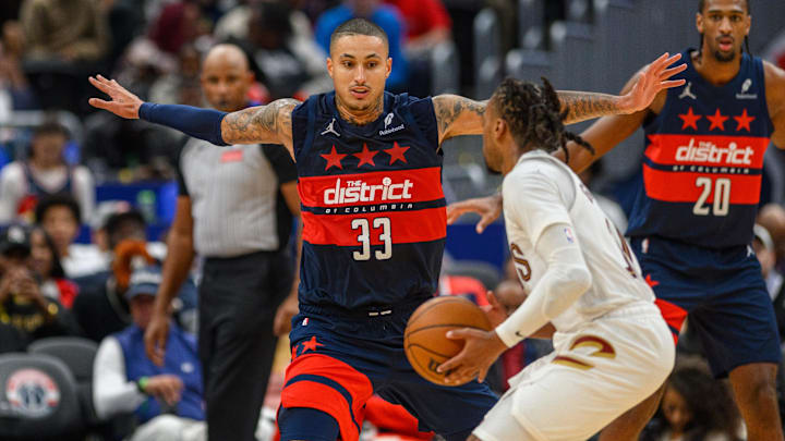 Oct 26, 2024; Washington, District of Columbia, USA; Washington Wizards forward Kyle Kuzma (33) defends against Cleveland Cavaliers guard Darius Garland (10) during the second quarter at Capital One Arena. Mandatory Credit: Reggie Hildred-Imagn Images