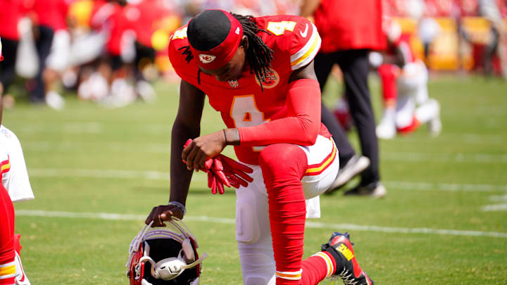 Aug 17, 2024; Kansas City, Missouri, USA; Kansas City Chiefs wide receiver Rashee Rice (4) kneels on field against the Detroit Lions prior to the game at GEHA Field at Arrowhead Stadium. Mandatory Credit: Denny Medley-Imagn Images