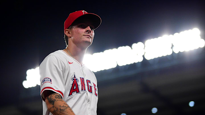 Jun 25, 2024; Anaheim, California, USA; Los Angeles Angels center fielder Mickey Moniak (16) returns to the dugout following the top of the seventh inning against the Oakland Athletics at Angel Stadium. Mandatory Credit: Gary A. Vasquez-USA TODAY Sports