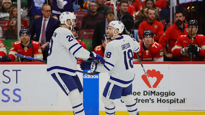 Apr 16, 2024; Sunrise, Florida, USA; Toronto Maple Leafs center Noah Gregor (18) celebrates with defenseman Joel Edmundson (20) after scoring against the Florida Panthers during the first period at Amerant Bank Arena. Mandatory Credit: Sam Navarro-USA TODAY Sports
