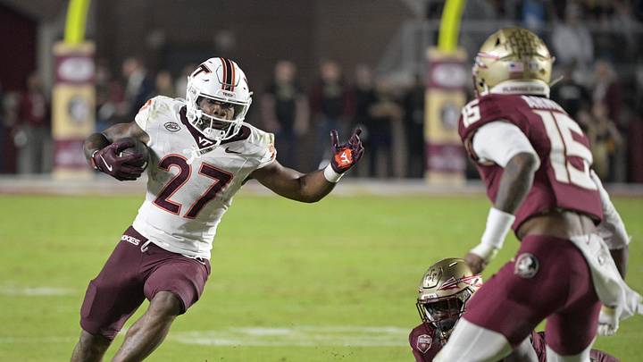 Nov 15, 2025; Tallahassee, Florida, USA; Virginia Tech Hokies running back Marcellous Hawkins (27) runs the ball during the second half against the Florida State Seminoles at Doak S. Campbell Stadium. Mandatory Credit: Melina Myers-Imagn Images