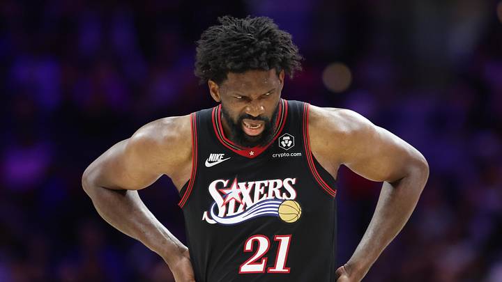 Feb 26, 2026; Philadelphia, Pennsylvania, USA; Philadelphia 76ers center Joel Embiid (21) reacts while clutching his body after a play against the Miami Heat during the second quarter at Xfinity Mobile Arena. Mandatory Credit: Bill Streicher-Imagn Images