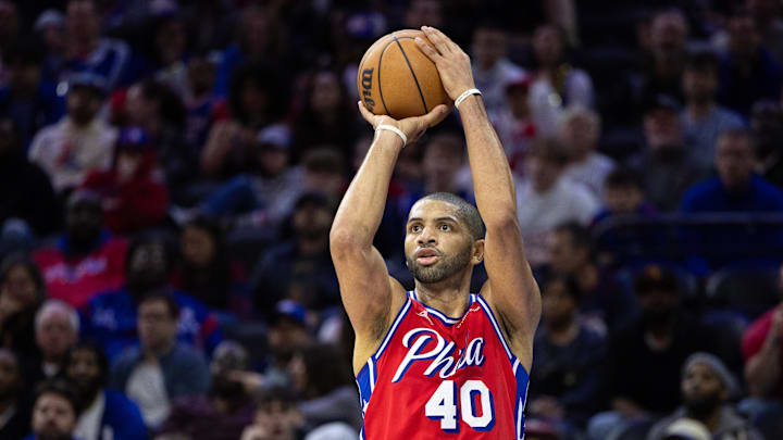 Apr 12, 2024; Philadelphia, Pennsylvania, USA; Philadelphia 76ers forward Nicolas Batum (40) shoots the ball against the Orlando Magic during the fourth quarter at Wells Fargo Center. Mandatory Credit: Bill Streicher-Imagn Images