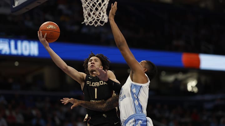 Mar 14, 2024; Washington, D.C., USA; Florida State guard Jalen Warley (1) shoots the ball as North Carolina forward Armando Bacot (5) defends in the first half at Capital One Arena. Mandatory Credit: Geoff Burke-Imagn Images
