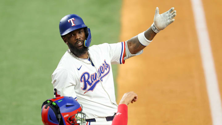 May 28, 2025; Arlington, Texas, USA; Texas Rangers right fielder Adolis Garcia (53) reacts in front of Toronto Blue Jays catcher Ali Sanchez (20) during the game at Globe Life Field. Mandatory Credit: Kevin Jairaj-Imagn Images