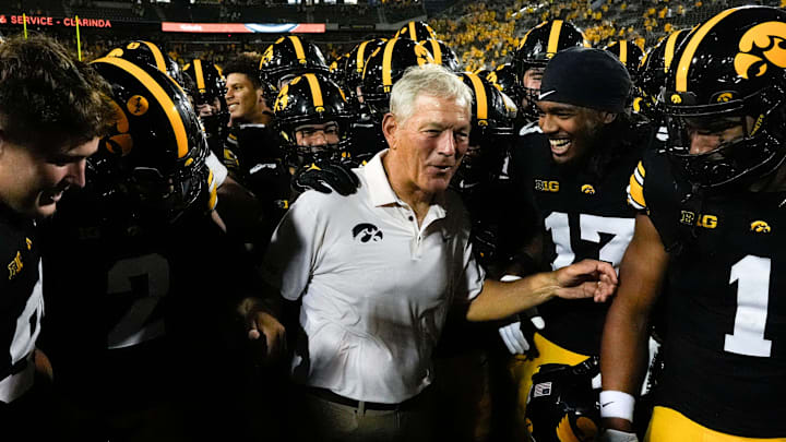 Iowa Hawkeyes head coach Kirk Ferentz celebrates with his players after becoming the winningest coach in Big Ten history, passing Woody Hayes, with a win over the Massachusetts Minutemen Sept. 13, 2025 at Kinnick Stadium in Iowa City, Iowa.