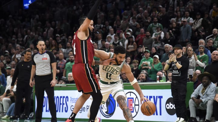 Apr 21, 2024; Boston, Massachusetts, USA; Boston Celtics forward Jayson Tatum (0) controls the ball vs. Miami Heat forward Caleb Martin.