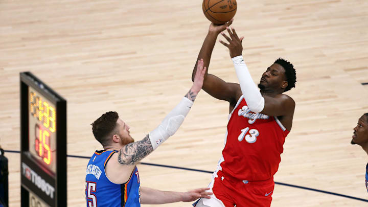 Apr 26, 2025; Memphis, Tennessee, USA; Memphis Grizzlies forward Jaren Jackson Jr. (13) shoots as Oklahoma City Thunder center Isaiah Hartenstein (55) defends during the second quarter during game four for the first round of the 2024 NBA Playoffs at FedExForum. Mandatory Credit: Petre Thomas-Imagn Images