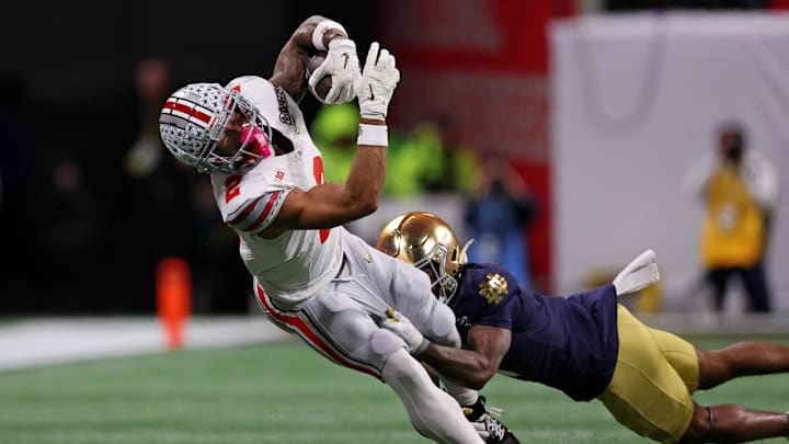 Jan 20, 2025; Atlanta, GA, USA; Ohio State Buckeyes wide receiver Emeka Egbuka (2) runs with the ball against the Notre Dame Fighting Irish during the first half the CFP National Championship college football game at Mercedes-Benz Stadium. Mandatory Credit: Brett Davis-Imagn Images