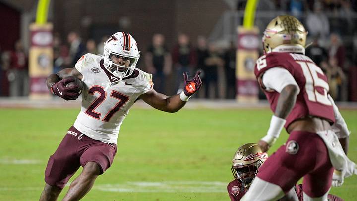 Nov 15, 2025; Tallahassee, Florida, USA; Virginia Tech Hokies running back Marcellous Hawkins (27) runs the ball during the second half against the Florida State Seminoles at Doak S. Campbell Stadium. Mandatory Credit: Melina Myers-Imagn Images Nov 15, 2025; Tallahassee, Florida, USA; Virginia Tech Hokies running back Marcellous Hawkins (27) runs the ball during the second half against the Florida State Seminoles at Doak S. Campbell Stadium. Mandatory Credit: Melina Myers-Imagn Images