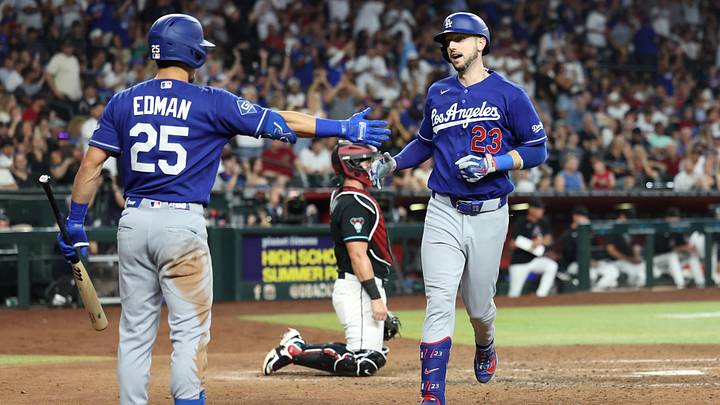 Aug 8, 2026; Phoenix, Arizona, USA; Los Angeles Dodgers outfielder Kyle Tucker (23) high fives Los Angeles Dodgers infielder Tommy Edman (25) after hitting a home run against Arizona Diamondbacks pitcher Jonathan Loaisiga (43) in the eighth inning at Chase Field. Mandatory Credit: Anna Carrington-Imagn Images Aug 8, 2026; Phoenix, Arizona, USA; Los Angeles Dodgers outfielder Kyle Tucker (23) high fives Los Angeles Dodgers infielder Tommy Edman (25) after hitting a home run against Arizona Diamondbacks pitcher Jonathan Loaisiga (43) in the eighth inning at Chase Field. Mandatory Credit: Anna Carrington-Imagn Images
