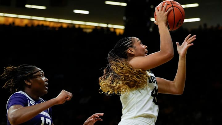 Iowa forward Hannah Stuelke (45) shoots against the Northwestern Wildcats Tuesday, Jan. 28, 2025 at Carver-Hawkeye Arena in Iowa City, Iowa.