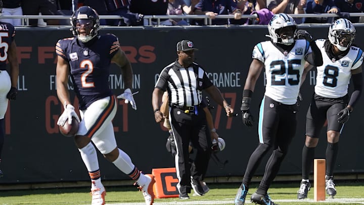 Oct 6, 2024; Chicago, Illinois, USA; Chicago Bears wide receiver DJ Moore (2) catches a touchdown pass as Carolina Panthers safety Xavier Woods (25) defends him during the first half at Soldier Field. Mandatory Credit: David Banks-Imagn Images