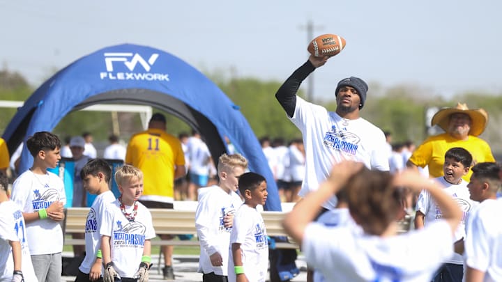 Dallas Cowboys linebacker Micah Parsons plays a scrimmage with campers at the Micah Parsons Lions Den Football Camp.