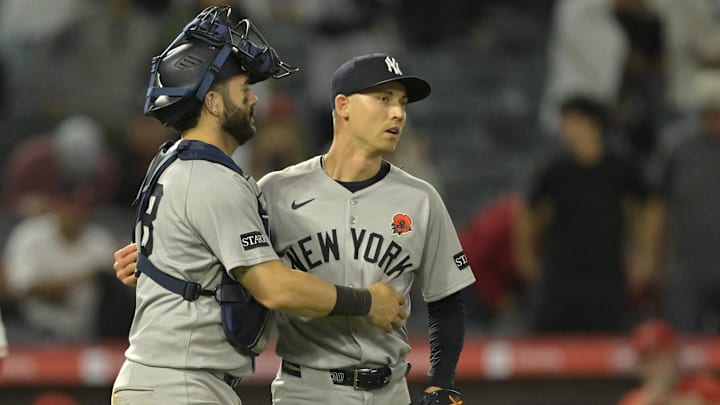 May 26, 2025; Anaheim, California, USA;  New York Yankees relief pitcher Luke Weaver (30) is congratulated by catcher Austin Wells (28) after the final out of the ninth inning against the Los Angeles Angels at Angel Stadium. Mandatory Credit: Jayne Kamin-Oncea-Imagn Images