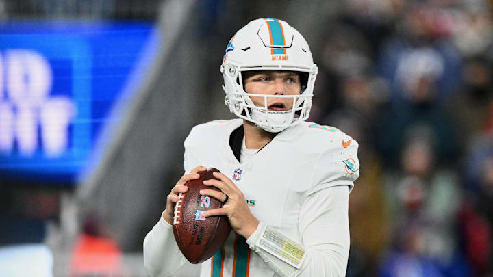 Jan 4, 2026; Foxborough, Massachusetts, USA; Miami Dolphins quarterback Zach Wilson (0) looks to throw a pass against the New England Patriots during the fourth quarter at Gillette Stadium. Mandatory Credit: Brian Fluharty-Imagn Images