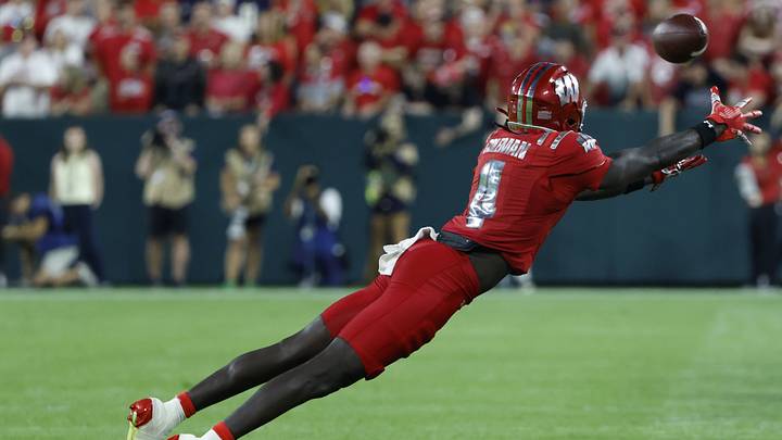 Sep 6, 2026; Green Bay, Wisconsin, USA;  Wisconsin Badgers wide receiver Malachi Coleman (4) attempts to make a catch against the Notre Dame Fighting Irish in the first half at Lambeau Field.  Mandatory Credit: Michael Caterina-Imagn Images