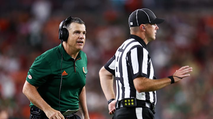 Sep 21, 2024; Tampa, Florida, USA; Miami Hurricanes head coach Mario Cristobal reacts to a play against the South Florida Bulls in the fourth quarter at Raymond James Stadium. Mandatory Credit: Nathan Ray Seebeck-Imagn Images