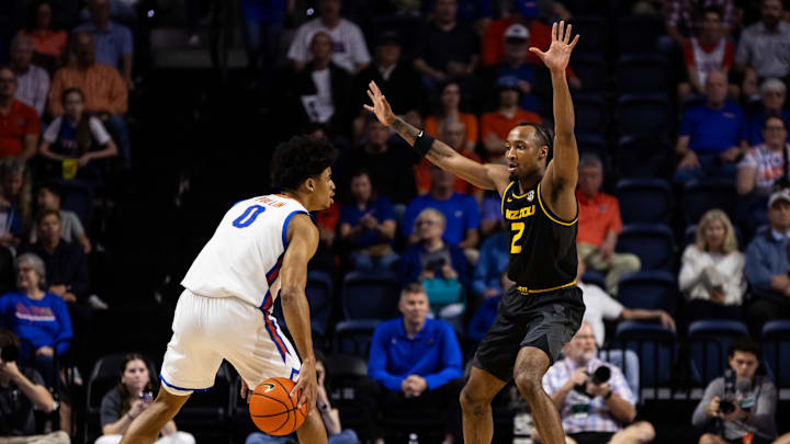 Feb 28, 2024; Gainesville, Florida, USA; Missouri Tigers guard Tamar Bates (2) defends Florida