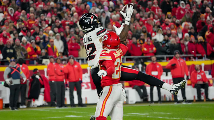 Dec 7, 2025; Kansas City, Missouri, USA; Houston Texans wide receiver Nico Collins (12) catches a pass against Kansas City Chiefs cornerback Trent McDuffie (22) during the first quarter at GEHA Field at Arrowhead Stadium. Mandatory Credit: Denny Medley-Imagn Images