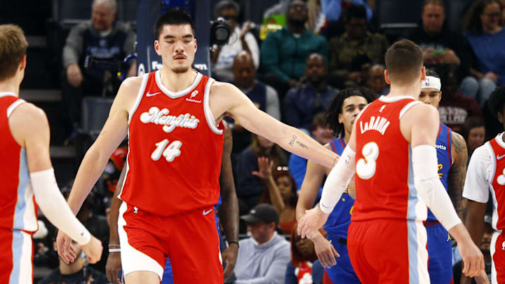 Nov 17, 2024; Memphis, Tennessee, USA; Memphis Grizzlies center Zach Edey (14) reacts with forward Jake LaRavia (3) during the first half against the Denver Nuggets at FedExForum. Mandatory Credit: Petre Thomas-Imagn Images