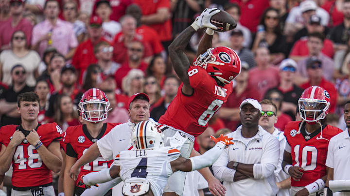 Georgia Bulldogs wide receiver Colbie Young (8) makes a catch over Auburn Tigers cornerback Kayin Lee (4) at Sanford Stadium.
