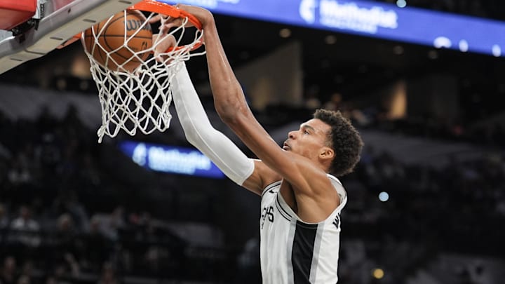 Oct 9, 2024; San Antonio, Texas, USA;  San Antonio Spurs center Victor Wembanyama (1) dunks in the first half against the Orlando Magic at Frost Bank Center. Mandatory Credit: Daniel Dunn-Imagn Images