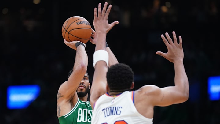 Boston Celtics forward Jayson Tatum shoots for three points against New York Knicks center Karl-Anthony Towns. Mandatory Credit: David Butler II-Imagn Images