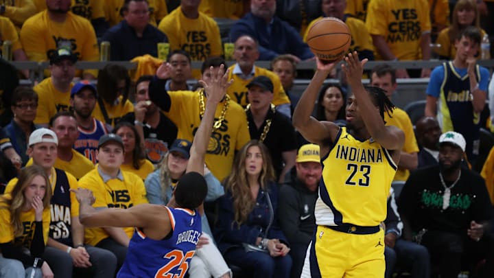 Indiana Pacers forward Aaron Nesmith shoots a three point basket over New York Knicks forward Mikal Bridges. Mandatory Credit: Trevor Ruszkowski-Imagn Images