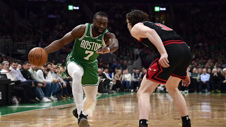 Jan 29, 2025; Boston, Massachusetts, USA; Boston Celtics guard Jaylen Brown (7) controls the ball while Chicago Bulls guard Josh Giddey (3) defends during the first half at TD Garden. Mandatory Credit: Bob DeChiara-Imagn Images