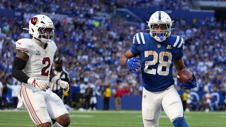 Arizona Cardinals linebacker Mack Wilson Sr. (2) watches as Indianapolis Colts running back Jonathan Taylor (28) scores a touchdown during a game on Sunday, Oct. 12, 2025, at Lucas Oil Stadium in Indianapolis. The Colts defeated the Cardinals 31-27.